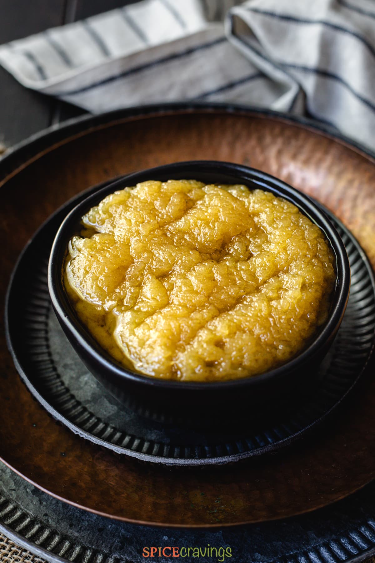 Bowl of halwa with ghee floating on top