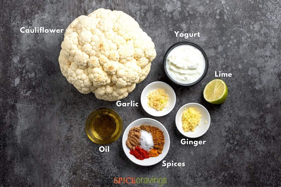 Ingredients for Tandoori Cauliflower on grey board