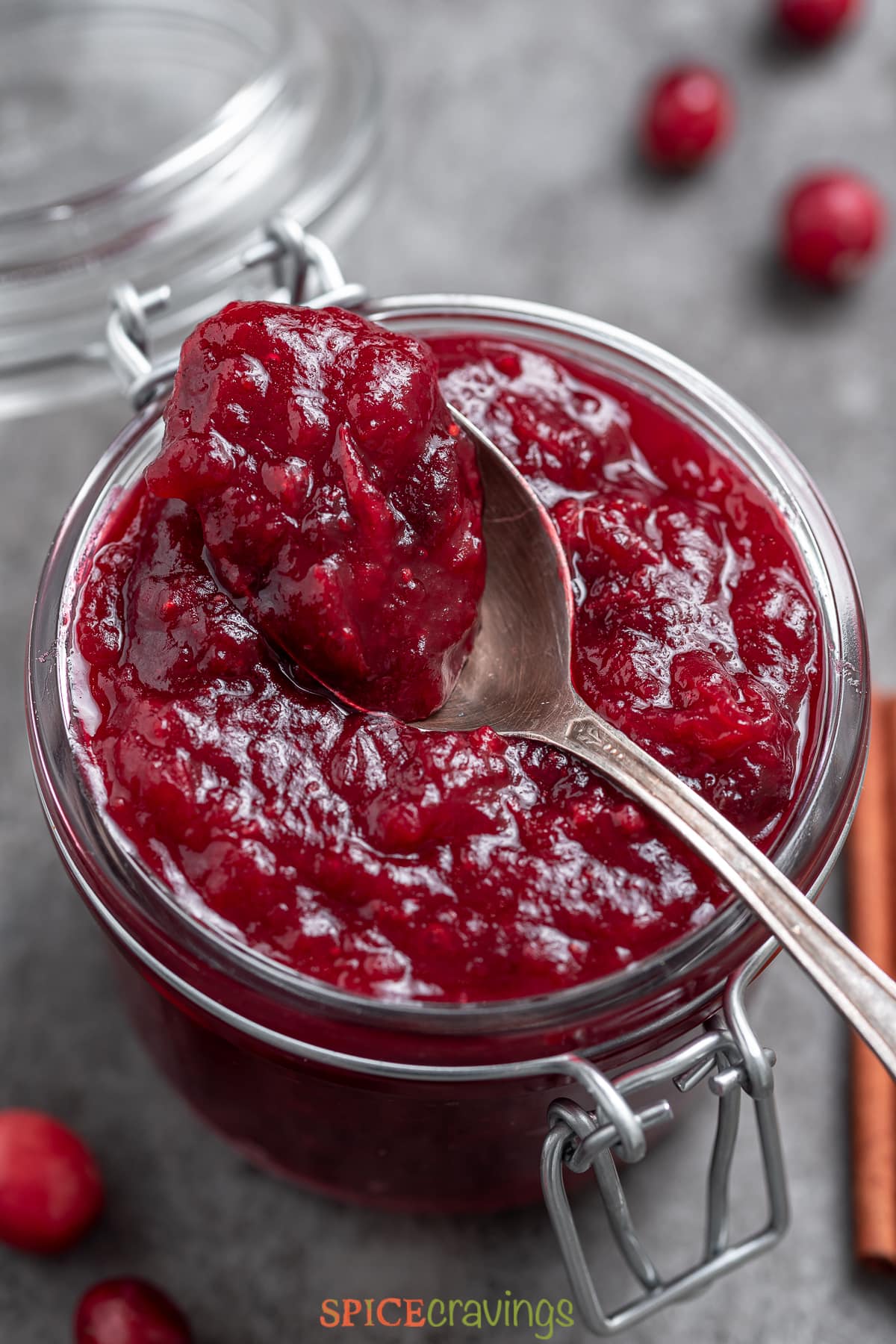 jar of cranberry chutney with spoon on top