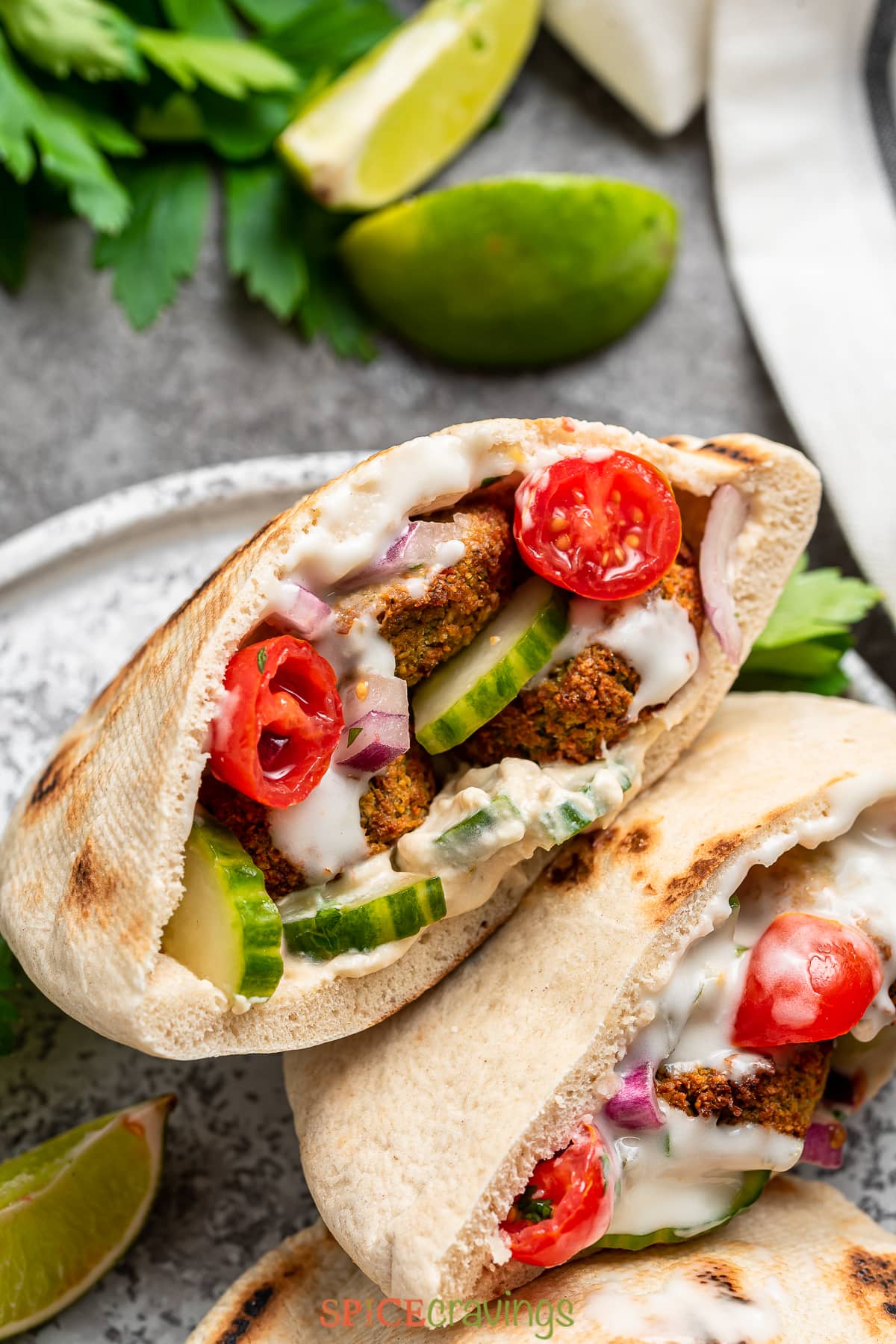 air fried falafel stuffed into pita bread with tzatziki, tomatoes, cucumber, and red onion