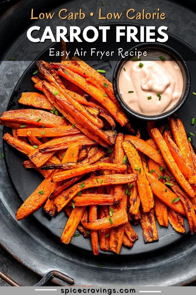 Carrot fries served with dipping sauce on black plate