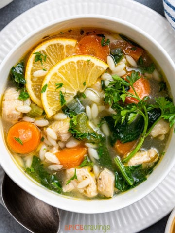 closeup of a bowl of lemon orzo soup from above