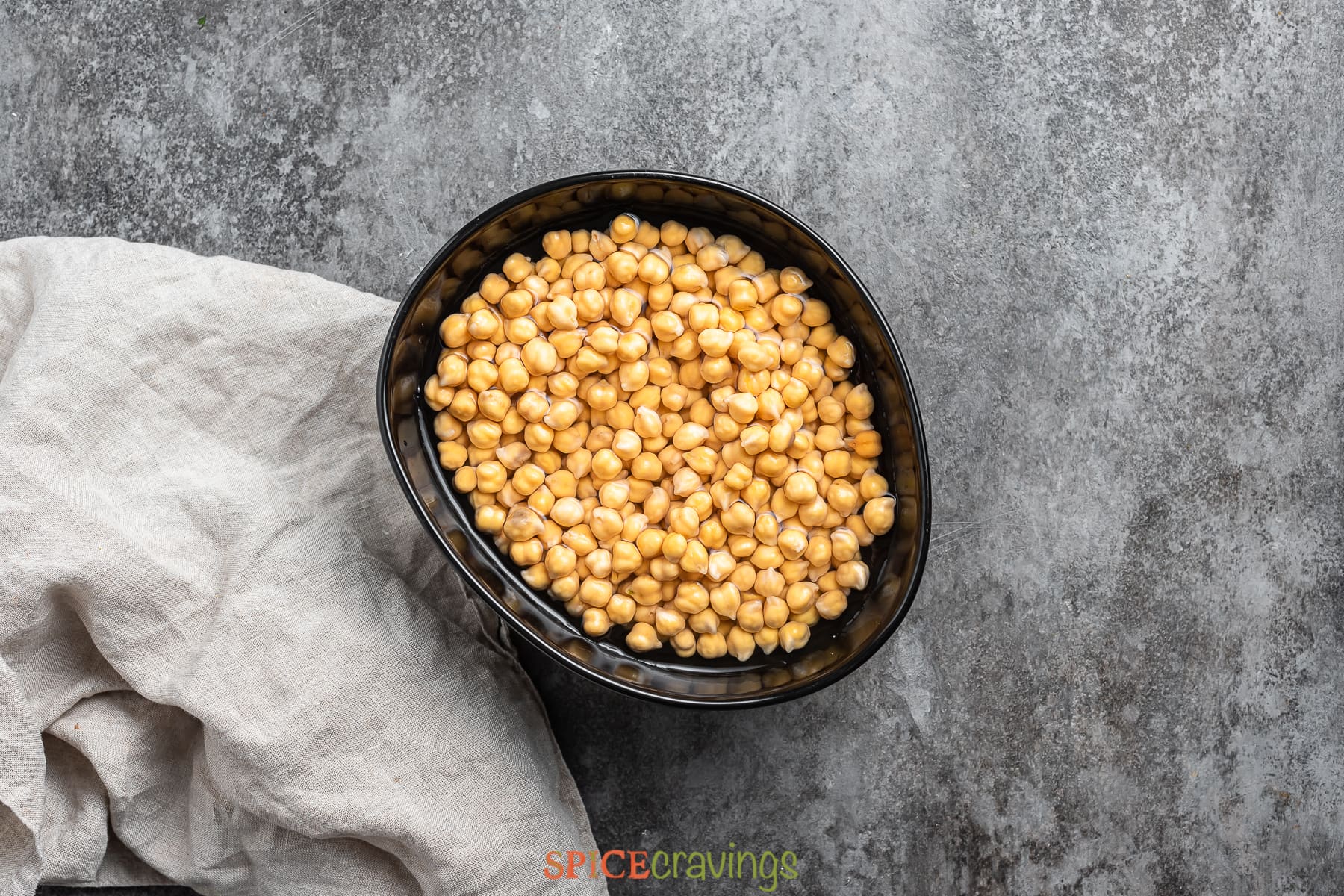 dried chickpeas in a bowl with water