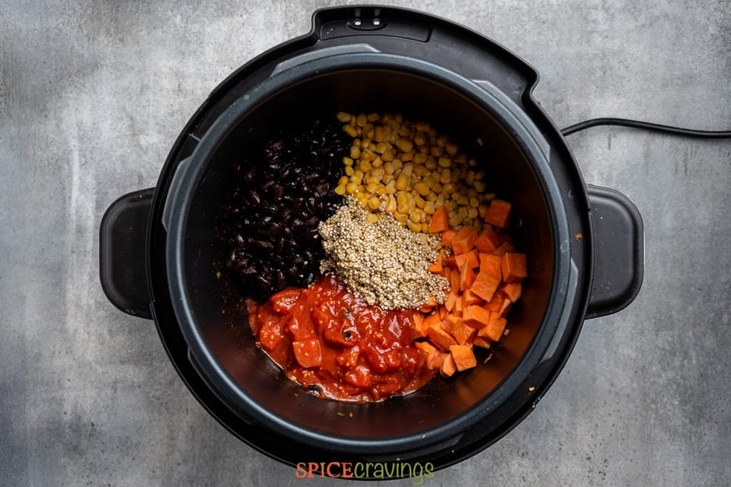 tomatoes, corn, beans, and sweet potato added to the instant pot