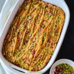 Baked Phyllo dough cake topped with nuts and dried rose