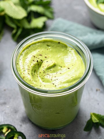 herbaceous green goddess sauce in glass jar