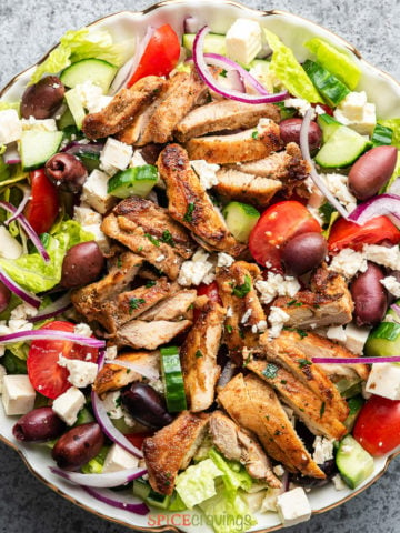 greek chicken salad recipe in large white bowl