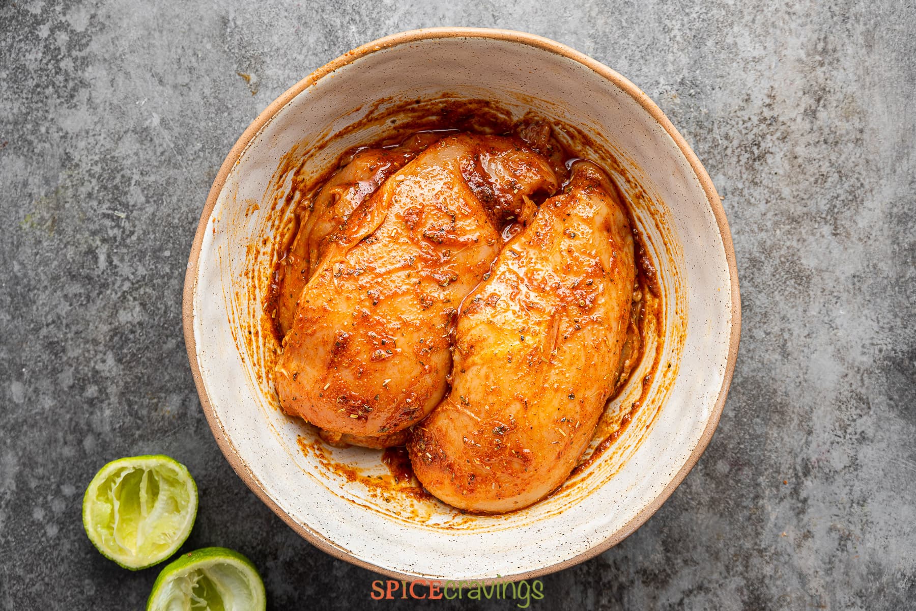 chicken breasts marinating in cajun wet rub