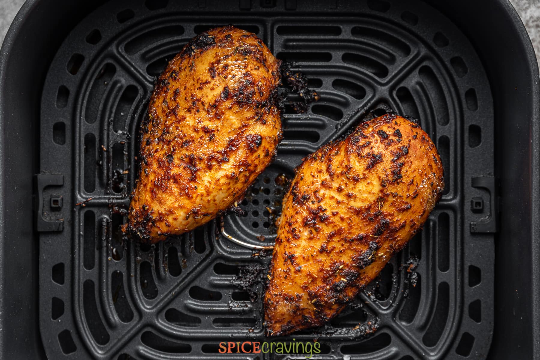 two cajun chickenbreasts in air fryer