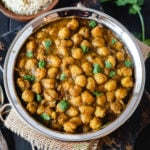 Indian chickpeas curry called chana masala in steel bowl