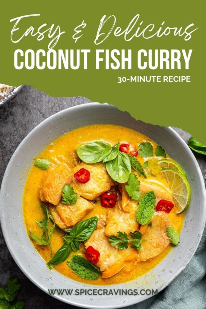 Fish curry with coconut milk in grey bowl with fresh herbs on top