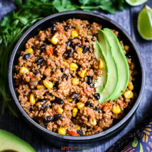Mexican flavored quinoa bowl with avocado slices