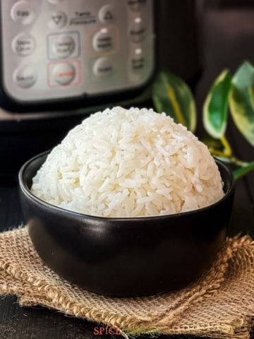 jasmine rice piled high in black bowl