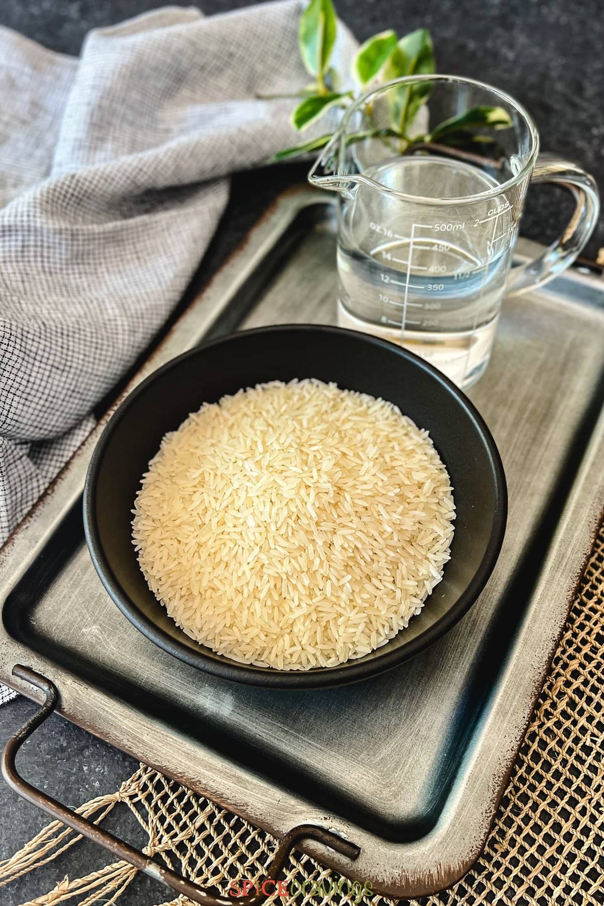 jasmine rice and water on serving tray
