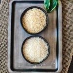 basmati vs jasmine rice in two separate black bowls on serving platter