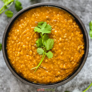 Ethiopian red lentil stew in bowl with cilantro