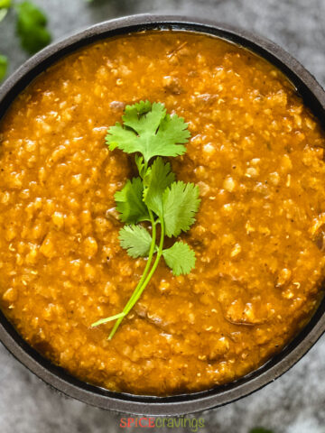 Ethiopian red lentil stew in bowl with cilantro