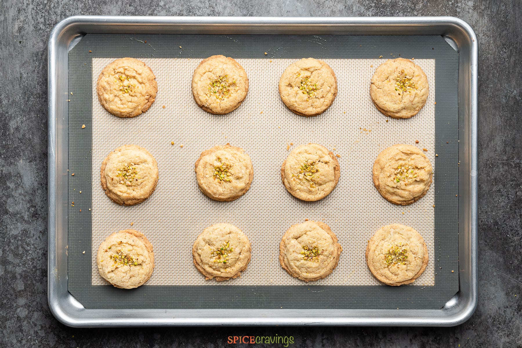 baked nankhatai biscuits on parchment lined baking sheet