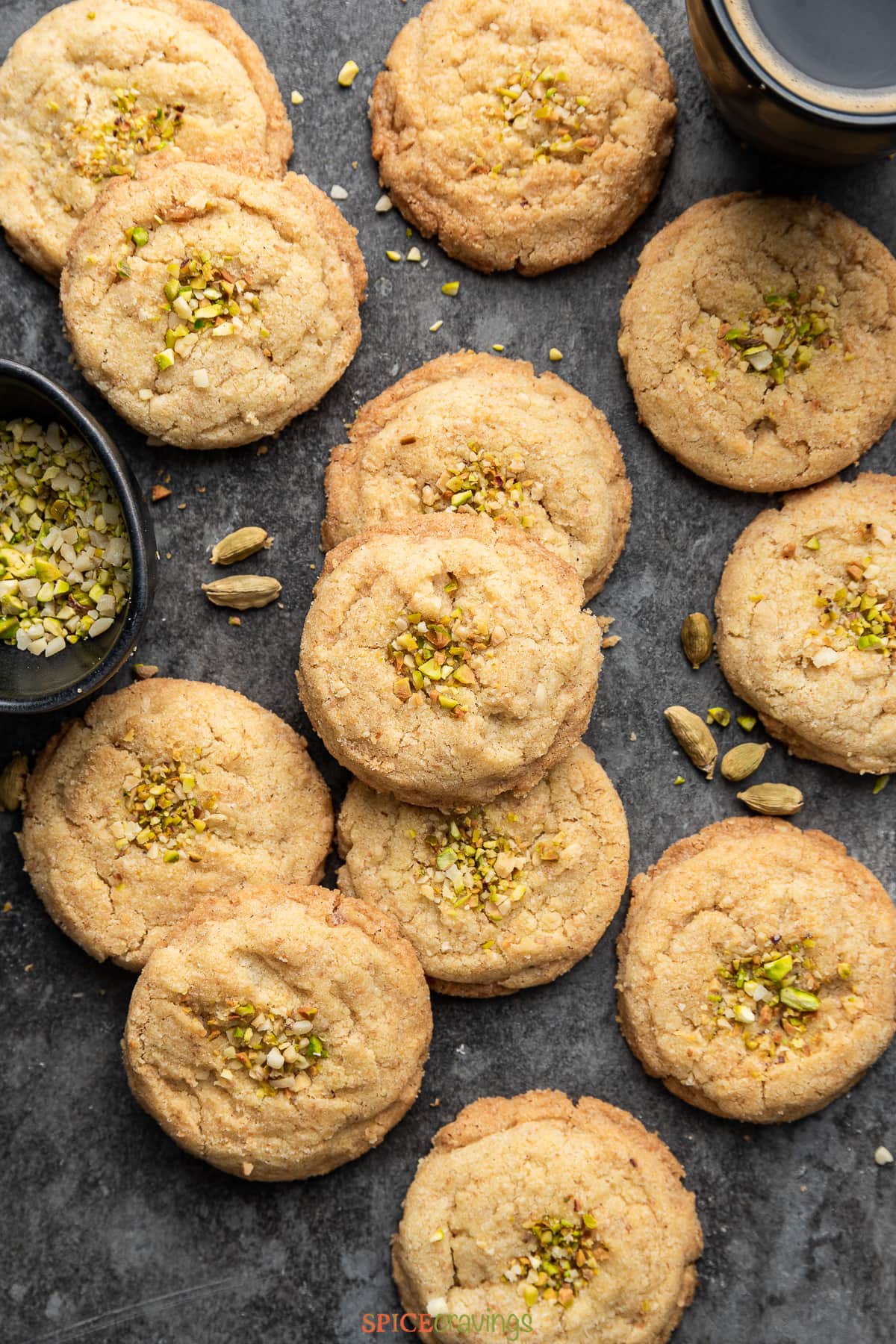 nankhatai cookies garnished with chopped almond and pistachios on black slate