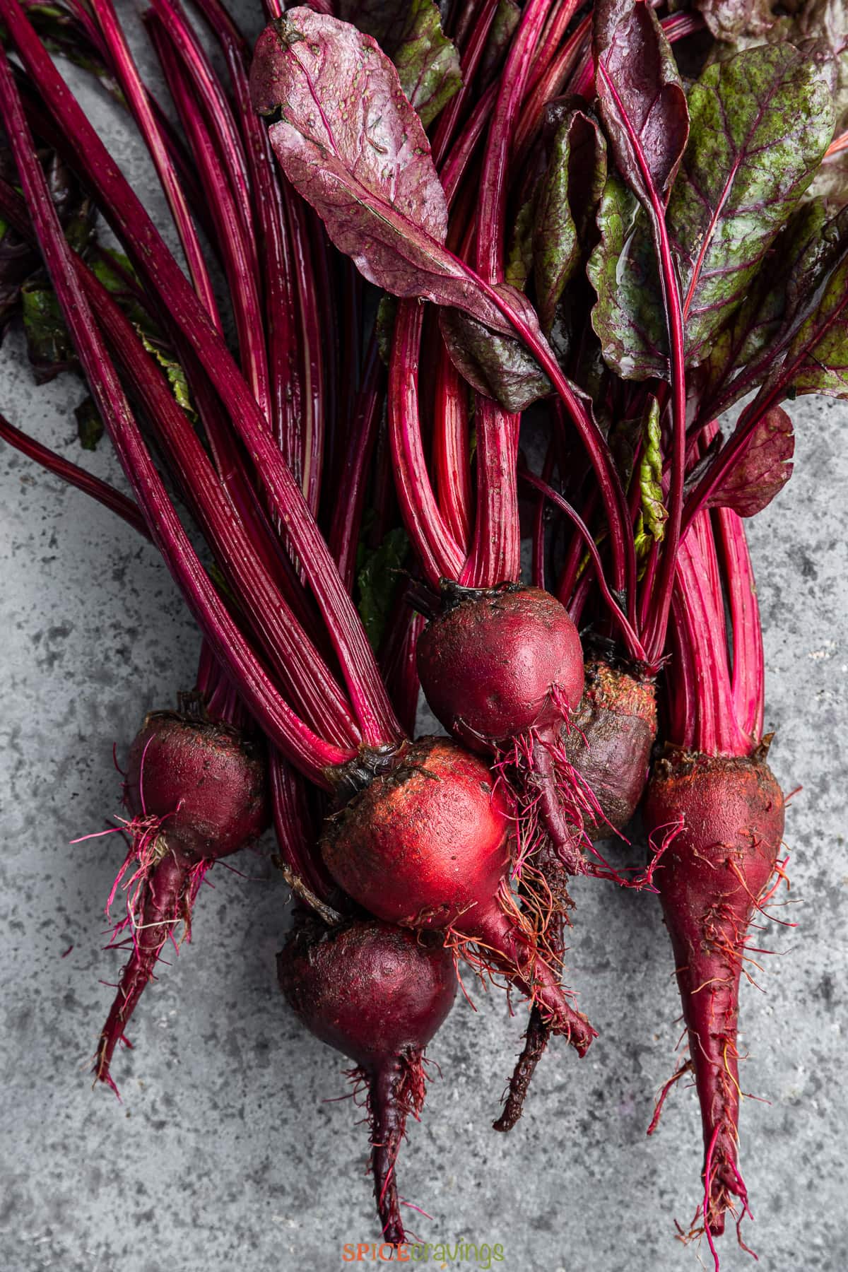 whole fresh ruby red beets with stems attached