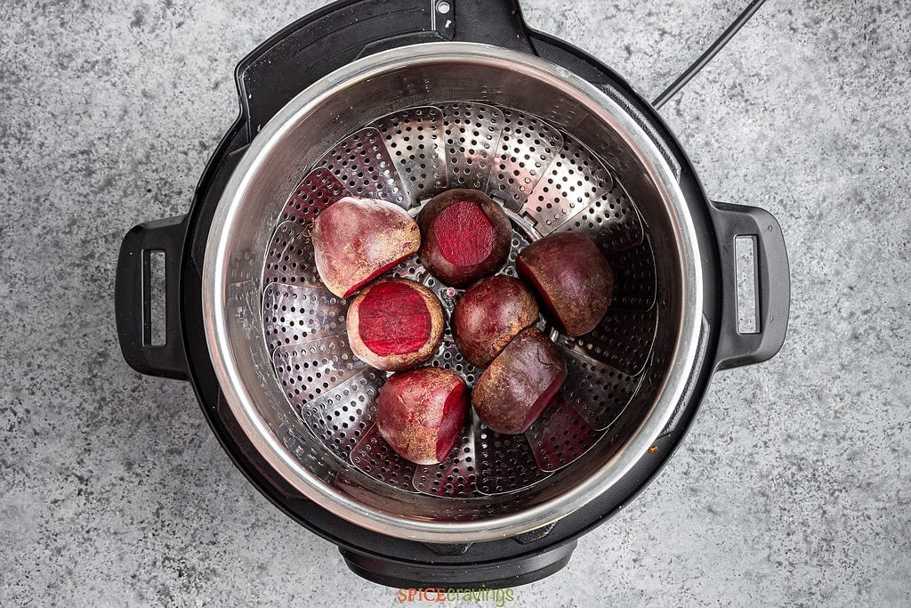 whole beets in steamer basket in Instant Pot