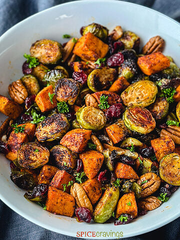 roasted brussel sprouts and sweet potatoes in large serving bowl