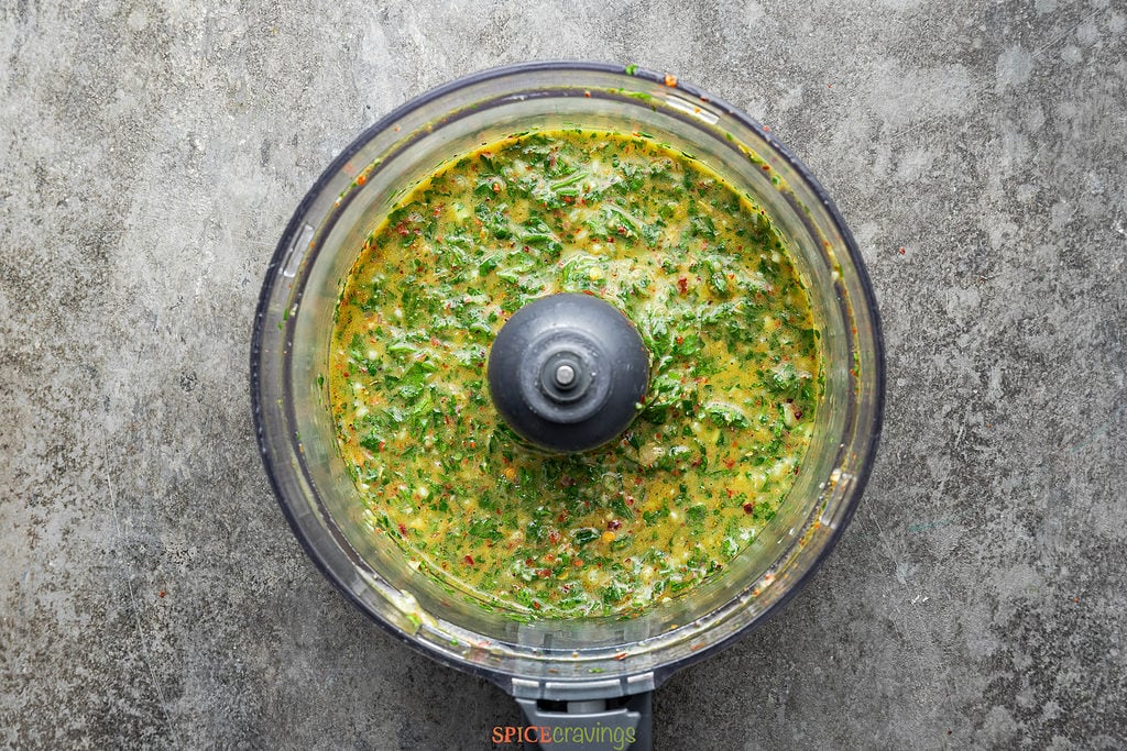 blended cilantro chimichurri in bowl of food processor