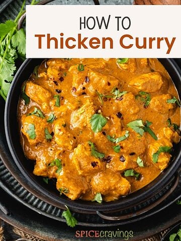 Creamy curry with chicken in black bowl
