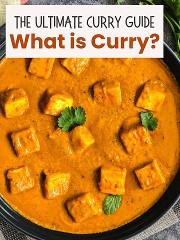 Bowl of paneer curry with cilantro leaves