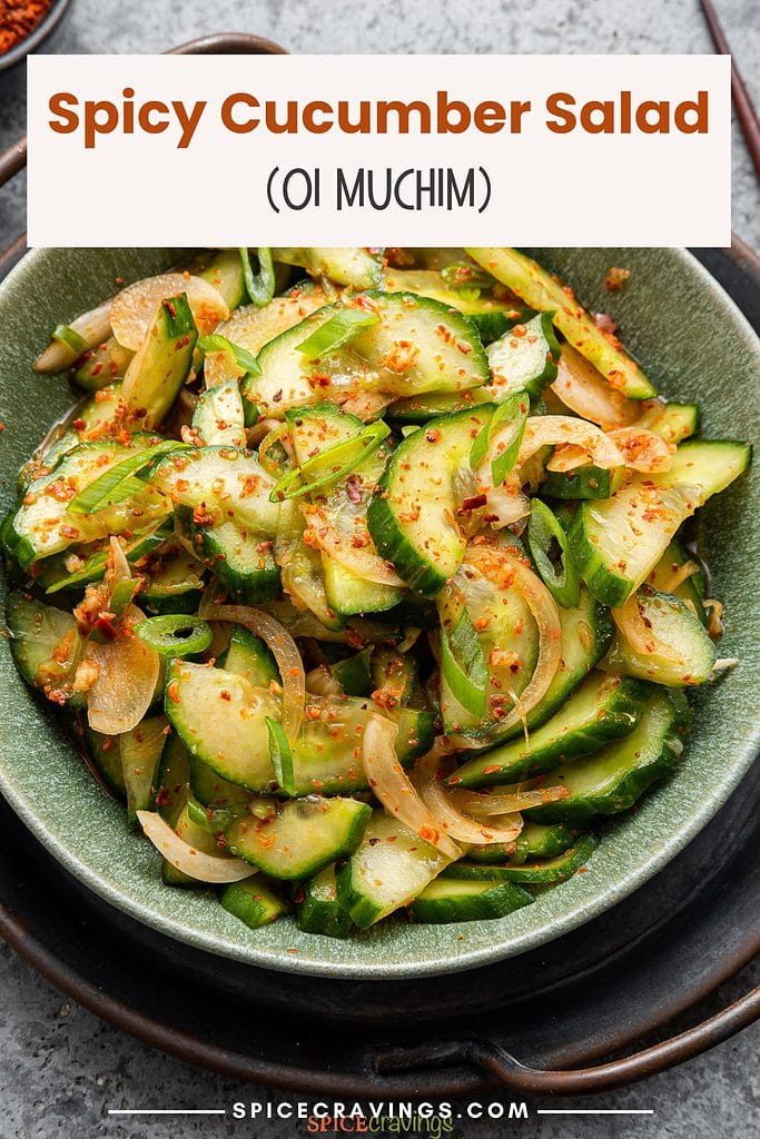 spicy cucumber salad with onion in green bowl