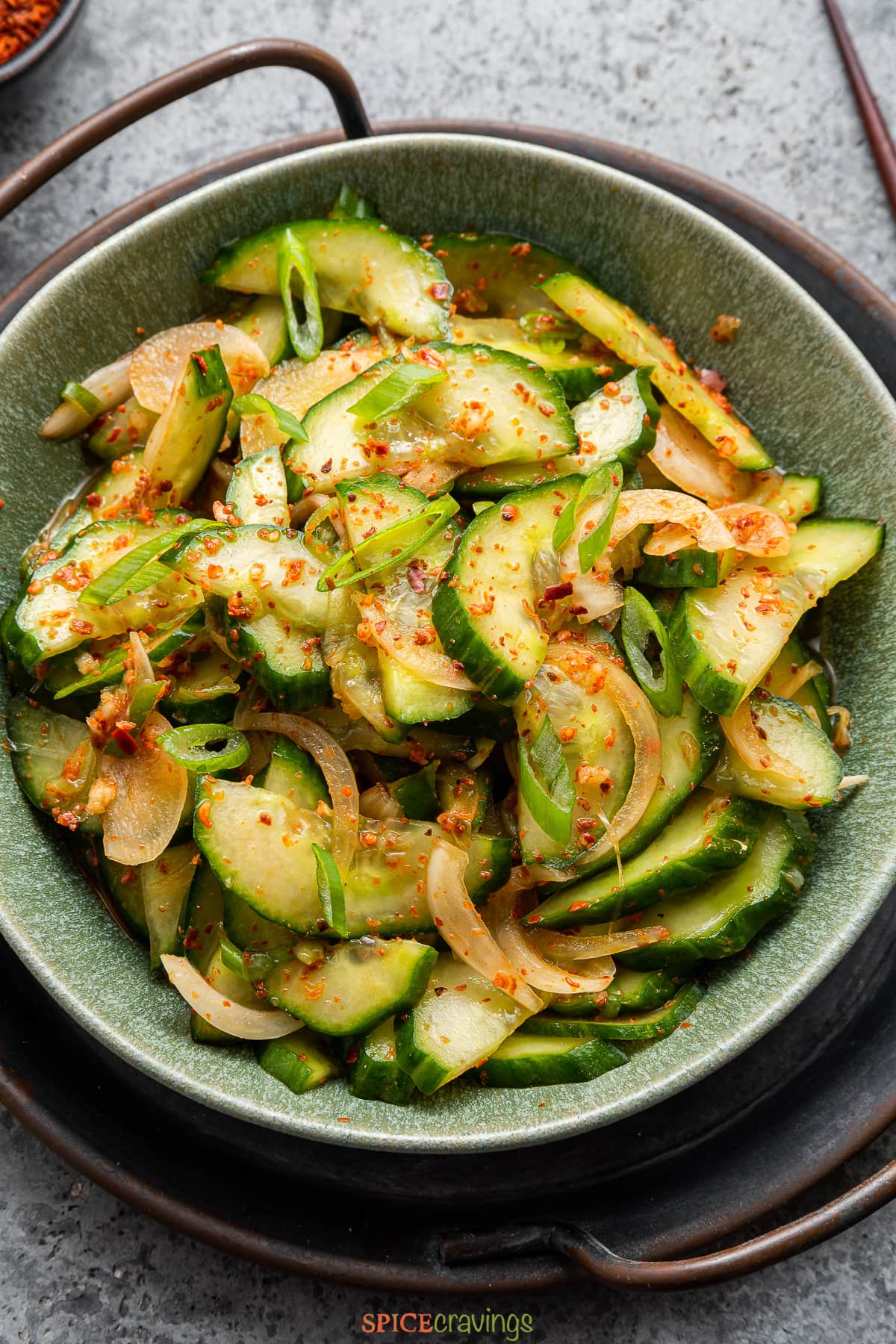 sliced cucumber salad with onion and red pepper flakes