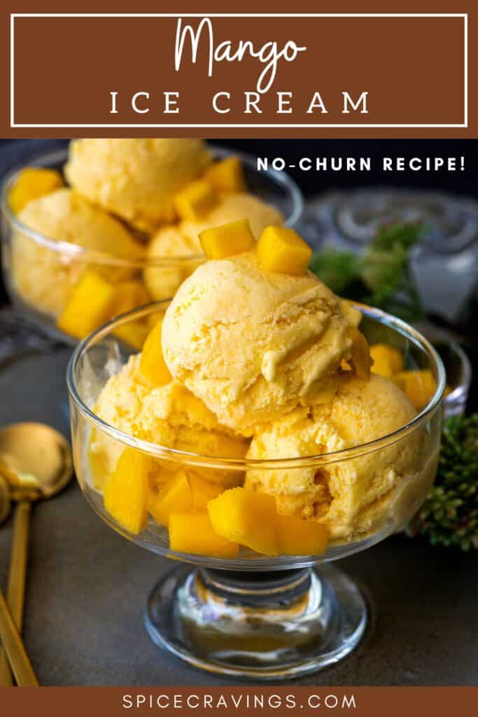 Three scoops of mango ice cream in a bowl topped with chopped mango