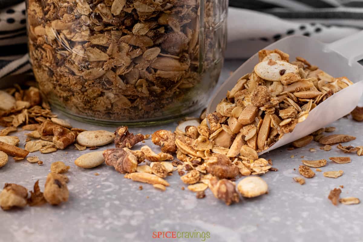 high protein granola with nuts and seeds in large scoop