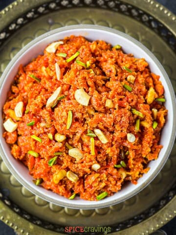 Top view of carrot halwa garnished with nuts