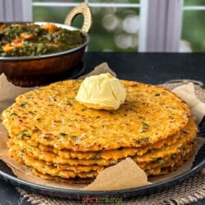 Stack of makki roti (indian flatbreads) with a dollop of butter