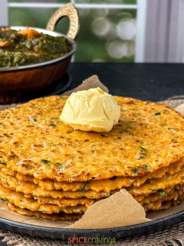 Stack of makki roti (indian flatbreads) with a dollop of butter