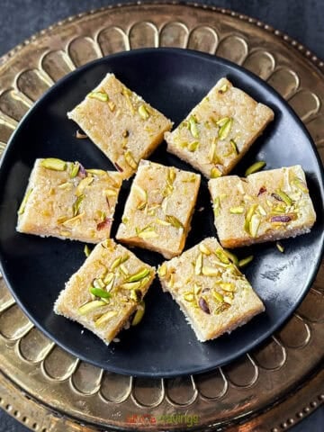 Burfi squares garnished with pistachios