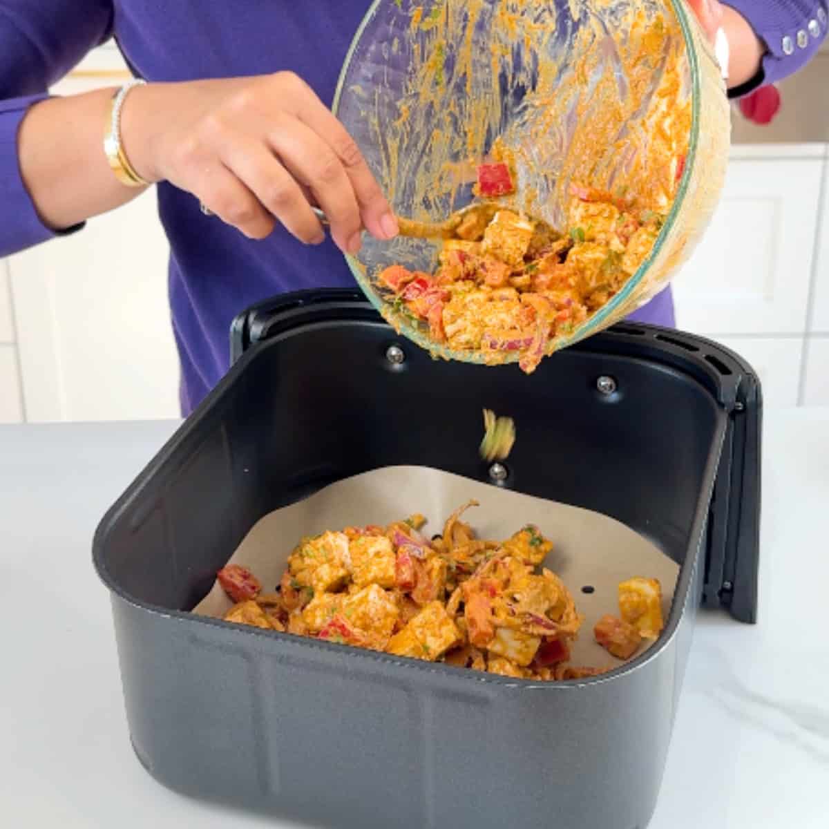 Adding marinated paneer and veggies to air fryer basket