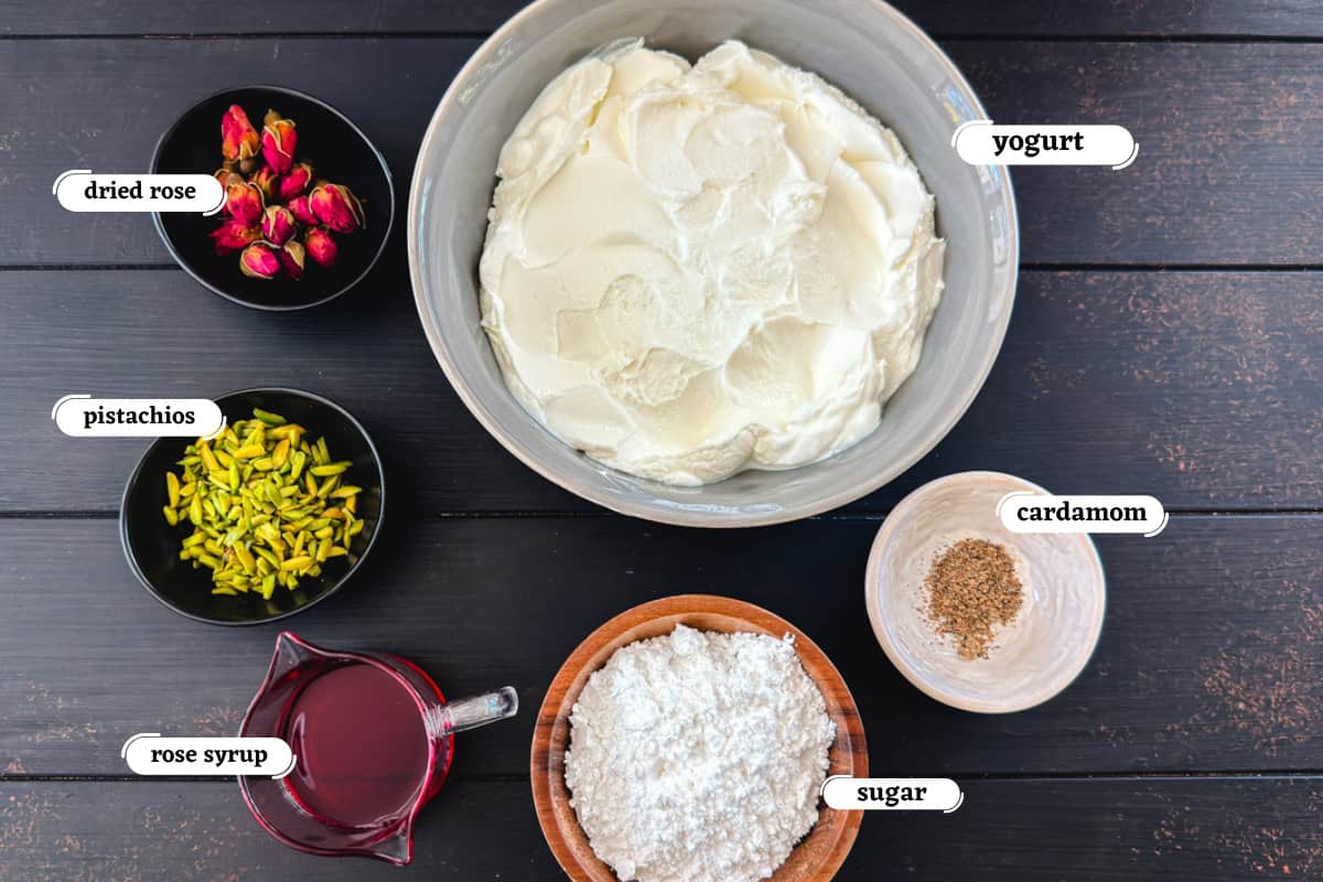 yogurt, rose syrup, sugar and pistachios among other ingredients for making rose shrikhand