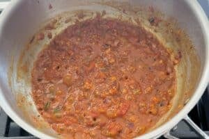 base curry ready in a pan for moong sprouts curry